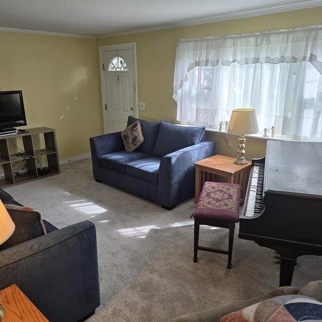 living room featuring ornamental molding, carpet, and baseboards
