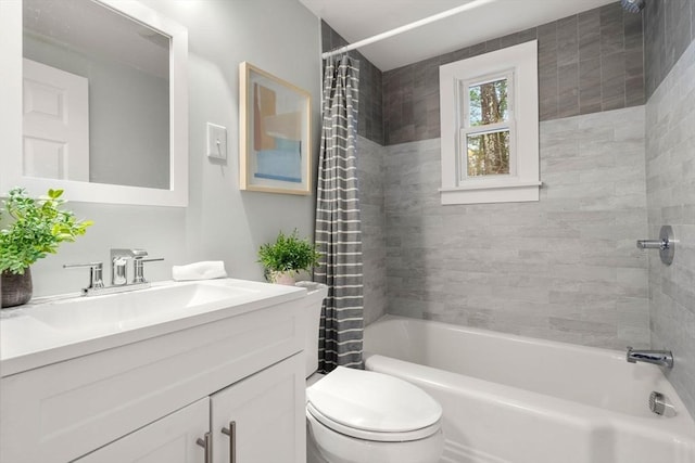 bathroom featuring vanity, toilet, and shower / tub combo