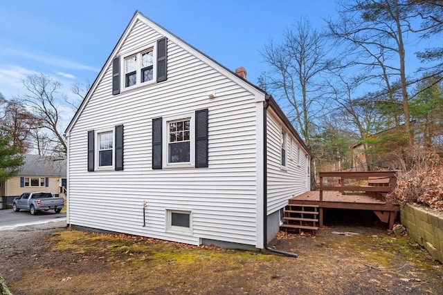 view of side of property featuring a deck