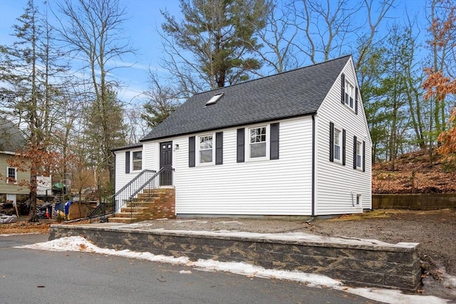 view of front facade with a shingled roof