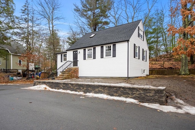 view of front of home with roof with shingles