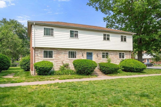 172 Bishop Dr Unit 172, Framingham, MA 01702 - view of front of home featuring a front lawn and stone siding