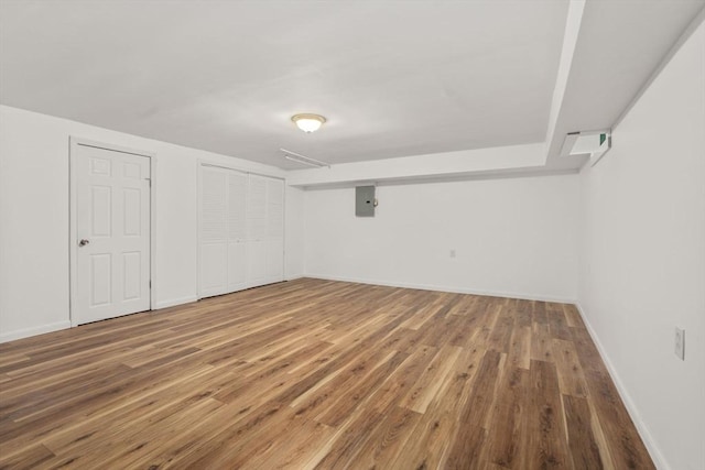 172 Bishop Dr Unit 172, Framingham, MA 01702 - finished below grade area featuring wood finished floors, electric panel, and baseboards
