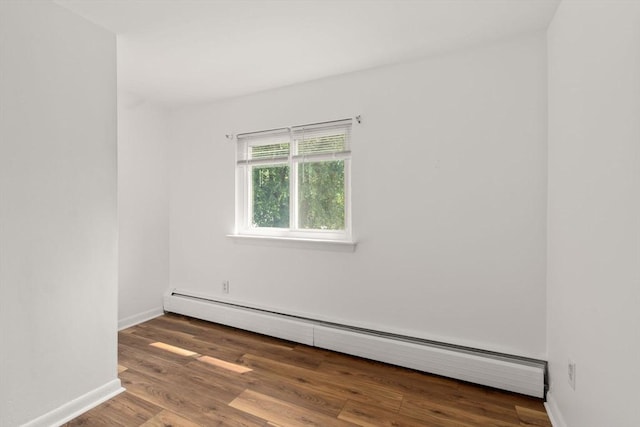 172 Bishop Dr Unit 172, Framingham, MA 01702 - unfurnished room with baseboard heating, wood finished floors, and baseboards