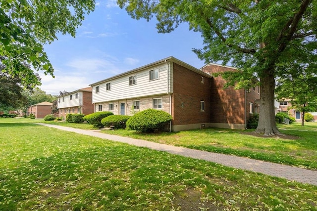 172 Bishop Dr Unit 172, Framingham, MA 01702 - view of front of home featuring a front lawn and brick siding