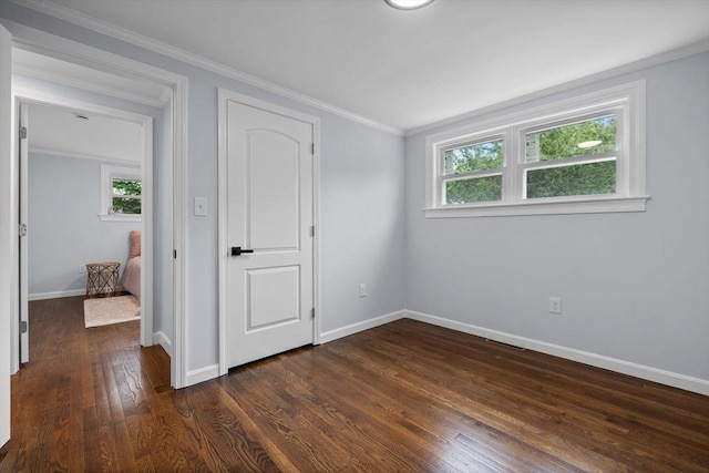 8 Piedmont St, Methuen, MA 01844 - unfurnished bedroom featuring dark wood-style flooring, baseboards, and crown molding