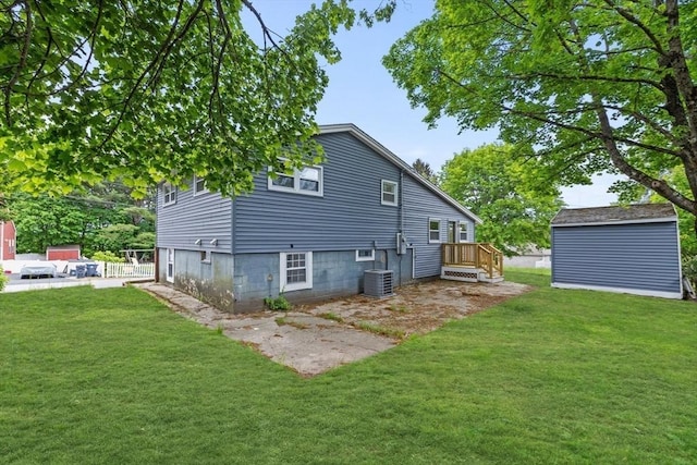8 Piedmont St, Methuen, MA 01844 - rear view of house featuring a yard, central AC, and a deck
