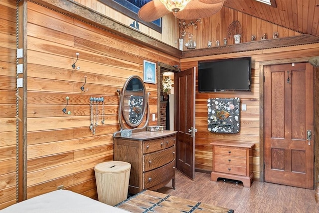 137 Rock Harbor Rd Unit 4, Orleans, MA 02653 - bedroom with wood walls, wood finished floors, high vaulted ceiling, and wooden ceiling