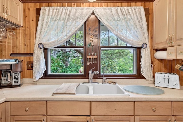 137 Rock Harbor Rd Unit 4, Orleans, MA 02653 - kitchen with light countertops, plenty of natural light, and wood walls