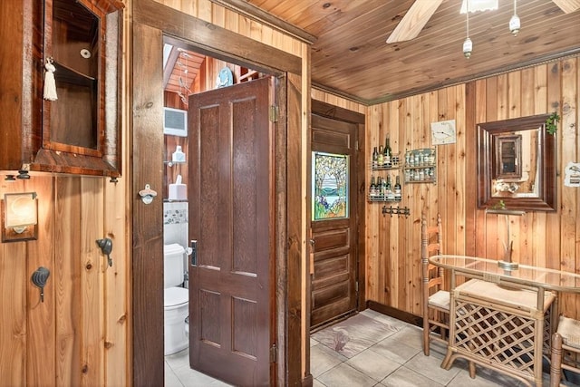 137 Rock Harbor Rd Unit 4, Orleans, MA 02653 - corridor featuring wooden walls, light tile patterned flooring, and wooden ceiling