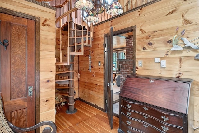 137 Rock Harbor Rd Unit 4, Orleans, MA 02653 - interior space with wood finished floors, a chandelier, and wooden walls