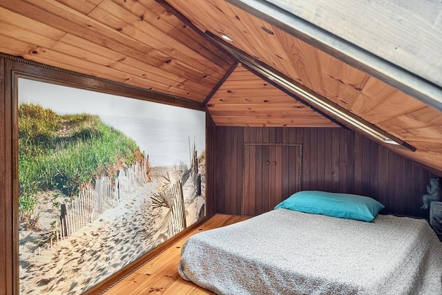 137 Rock Harbor Rd Unit 4, Orleans, MA 02653 - bedroom with wood ceiling, wooden walls, vaulted ceiling, and wood finished floors