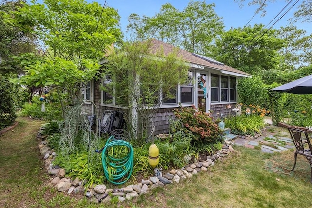 137 Rock Harbor Rd Unit 4, Orleans, MA 02653 - back of property featuring a sunroom