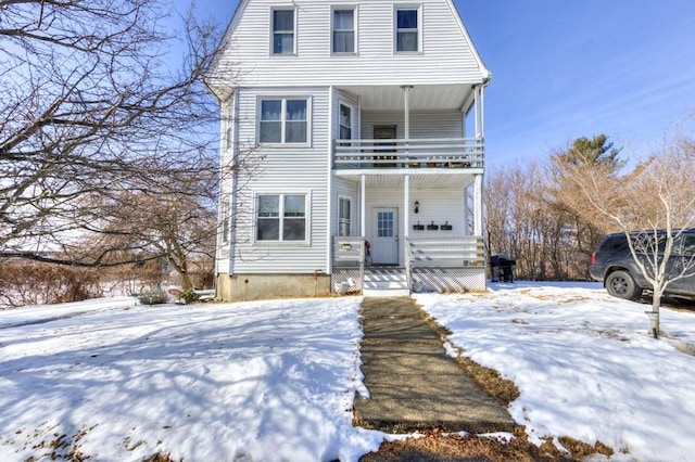 view of front of home with a balcony and covered porch