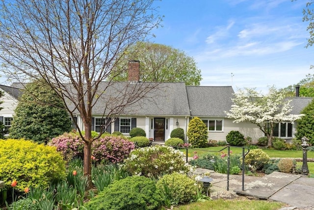38 Bullard St, Sherborn, MA 01770 - view of front facade with a chimney and a shingled roof