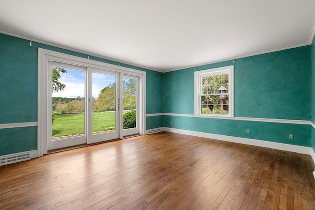 38 Bullard St, Sherborn, MA 01770 - unfurnished room featuring hardwood / wood-style floors, baseboards, and crown molding
