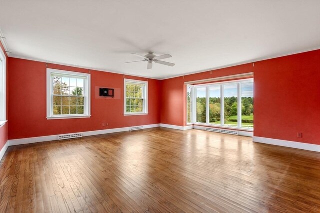 38 Bullard St, Sherborn, MA 01770 - unfurnished room featuring hardwood / wood-style flooring, ceiling fan, baseboards, and crown molding