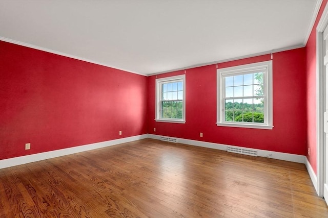 38 Bullard St, Sherborn, MA 01770 - spare room with wood finished floors, baseboards, and crown molding