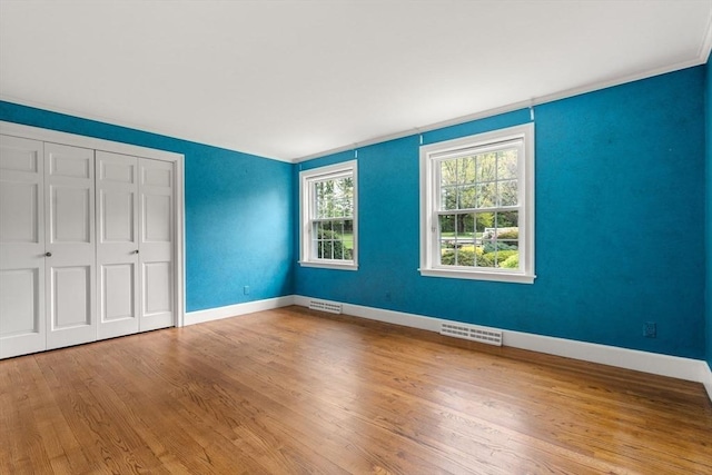 38 Bullard St, Sherborn, MA 01770 - unfurnished bedroom with wood finished floors, baseboards, and a closet