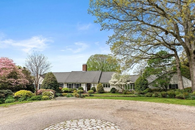 38 Bullard St, Sherborn, MA 01770 - view of front of home featuring a chimney and driveway