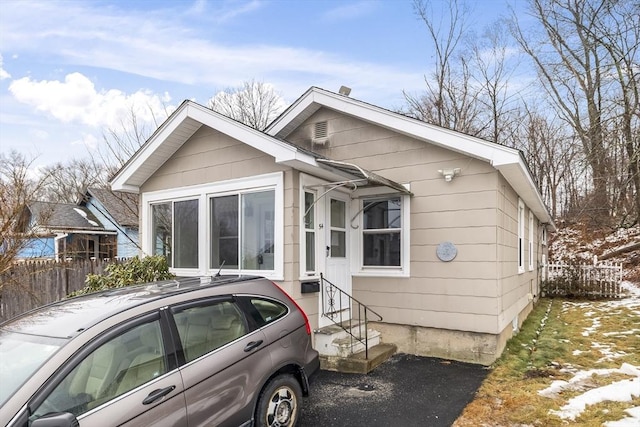 view of front of house featuring fence