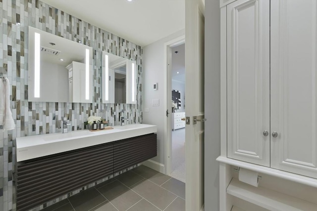 bathroom with vanity, tile patterned flooring, and decorative backsplash