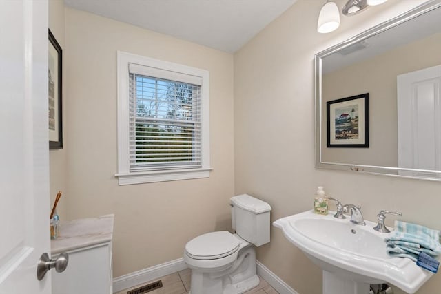 11 Winslow Way, Swansea, MA 02777 - bathroom with a sink, baseboards, tile patterned floors, and toilet