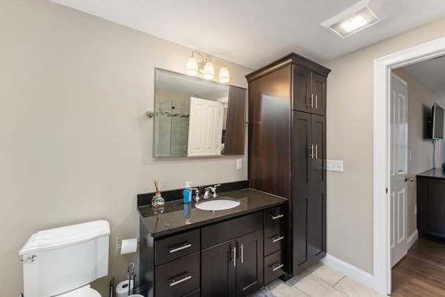 11 Winslow Way, Swansea, MA 02777 - full bathroom with vanity, toilet, a chandelier, and baseboards