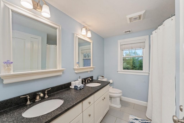 11 Winslow Way, Swansea, MA 02777 - full bath featuring tile patterned flooring, double vanity, toilet, and baseboards