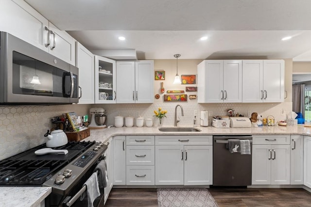 11 Winslow Way, Swansea, MA 02777 - kitchen featuring appliances with stainless steel finishes, a sink, dark wood-type flooring, white cabinets, and recessed lighting