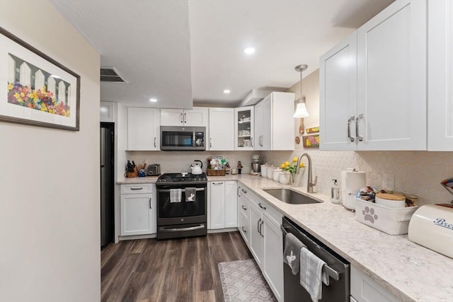 11 Winslow Way, Swansea, MA 02777 - kitchen featuring appliances with stainless steel finishes, a sink, dark wood-type flooring, white cabinetry, and recessed lighting