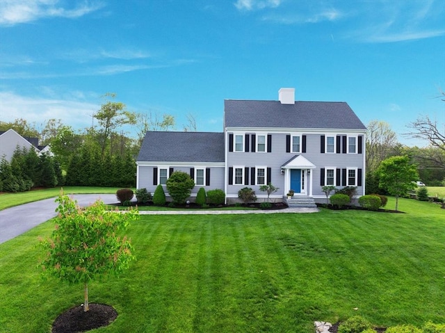 11 Winslow Way, Swansea, MA 02777 - colonial-style house with a front yard, a chimney, and a shingled roof