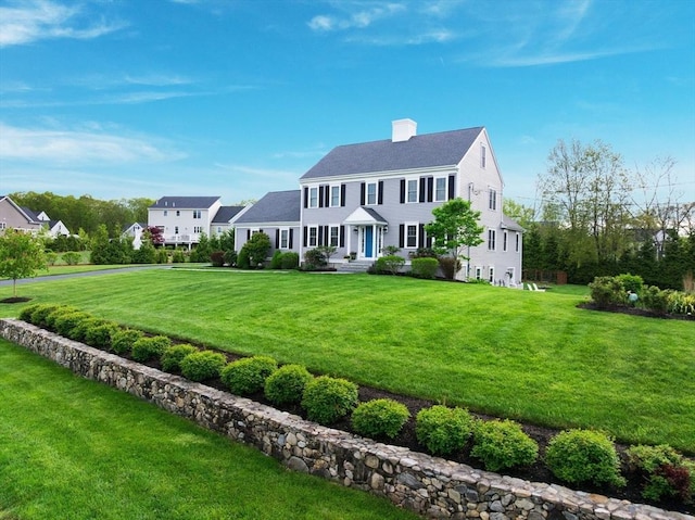 11 Winslow Way, Swansea, MA 02777 - view of front of house featuring a chimney and a front lawn
