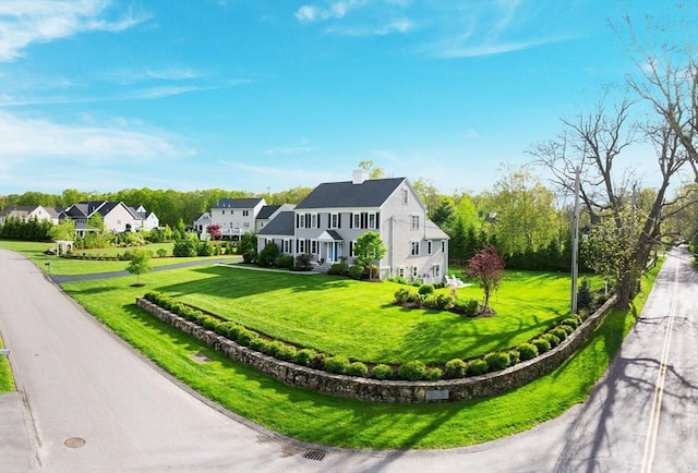 11 Winslow Way, Swansea, MA 02777 - view of front of home featuring a front yard, a residential view, and a chimney