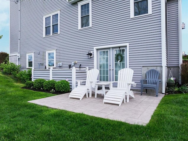 11 Winslow Way, Swansea, MA 02777 - back of property with french doors, a yard, and a patio area