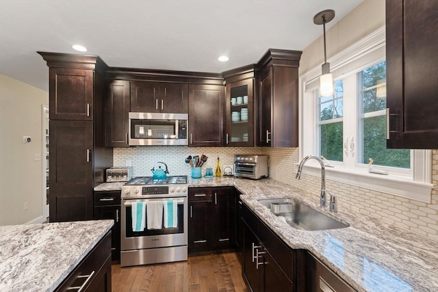 11 Winslow Way, Swansea, MA 02777 - kitchen with appliances with stainless steel finishes, a sink, dark wood-style flooring, light stone counters, and recessed lighting