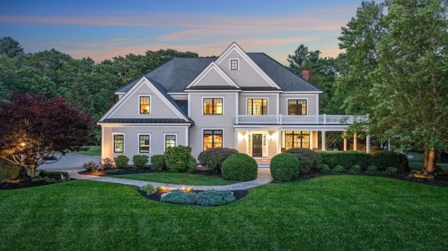 5 Carolina Way, Boxford, MA 01921 - view of front of house featuring a balcony, a standing seam roof, a yard, a metal roof, and a chimney