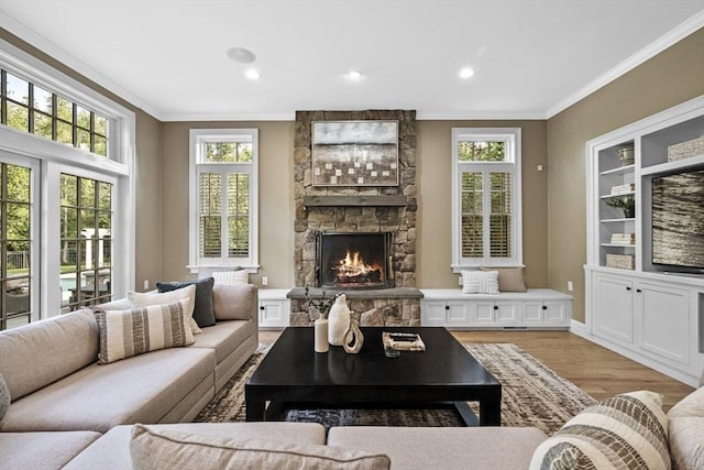 5 Carolina Way, Boxford, MA 01921 - living area with crown molding, a fireplace, plenty of natural light, light wood finished floors, and recessed lighting