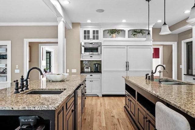 5 Carolina Way, Boxford, MA 01921 - kitchen with crown molding, light wood-style floors, white cabinets, paneled built in fridge, and hanging light fixtures
