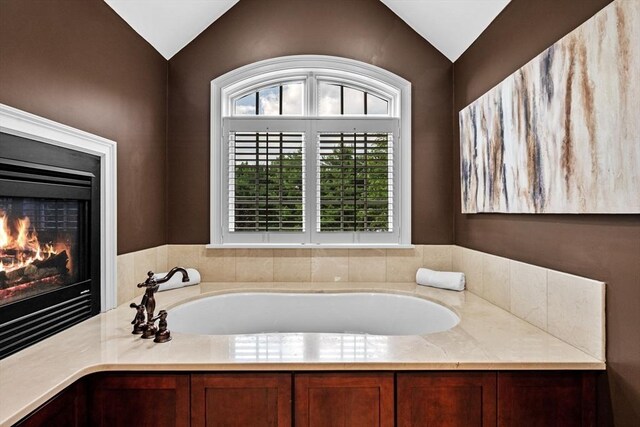 5 Carolina Way, Boxford, MA 01921 - bathroom featuring vaulted ceiling, a garden tub, and a glass covered fireplace