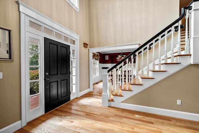 5 Carolina Way, Boxford, MA 01921 - entrance foyer featuring wood finished floors, stairs, a chandelier, and a towering ceiling