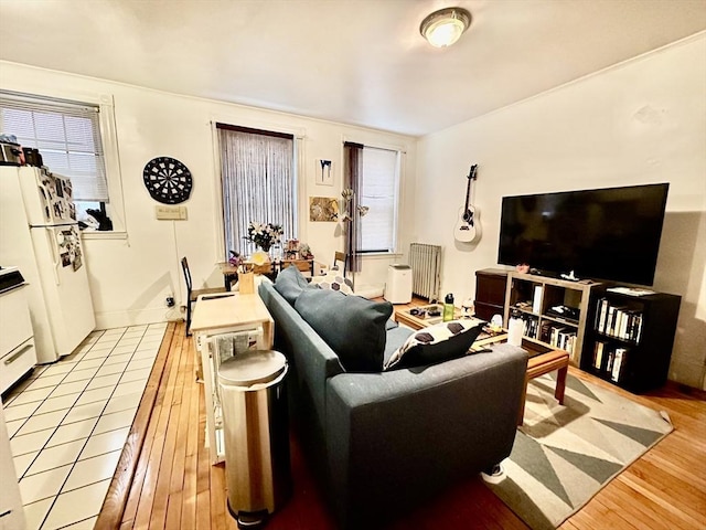 living room featuring wood finished floors and radiator heating unit