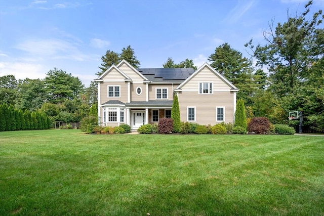 traditional home with solar panels and a front yard