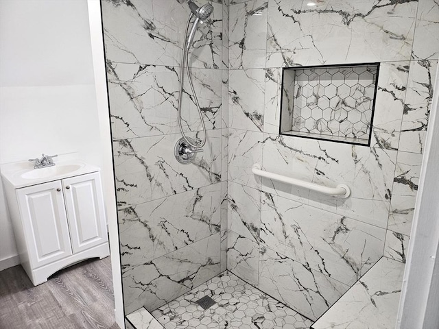 21 High St, South Hadley, MA 01075 - full bathroom with a shower stall, vanity, and wood finished floors
