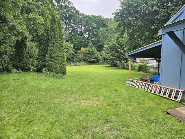 21 High St, South Hadley, MA 01075 - view of grassy yard featuring a view of trees