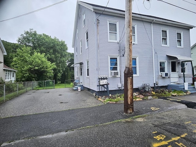21 High St, South Hadley, MA 01075 - view of side of property with cooling unit and uncovered parking