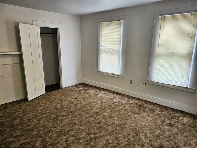 21 High St, South Hadley, MA 01075 - unfurnished bedroom featuring dark colored carpet and baseboards