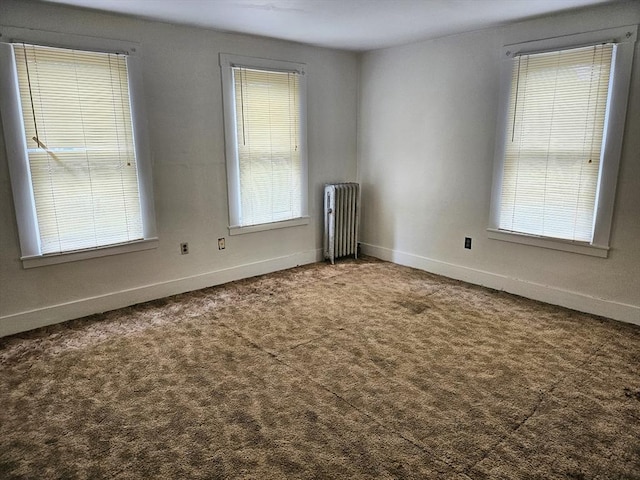 21 High St, South Hadley, MA 01075 - unfurnished room featuring radiator heating unit and carpet flooring