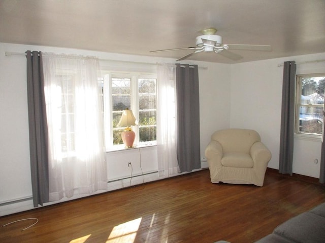 sitting room with hardwood / wood-style flooring, ceiling fan, and a healthy amount of sunlight