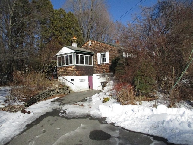 view of front facade featuring a sunroom